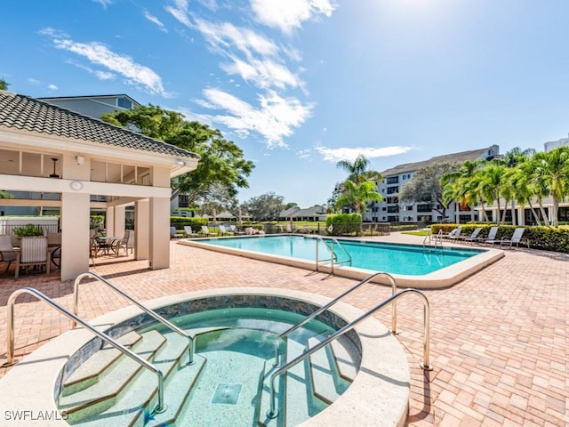 1001 Arbor Lake Dr Unit 1406, Naples, FL 34110 - community pool featuring a hot tub and a patio