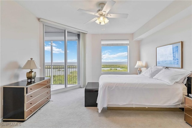 bedroom featuring carpet, access to outside, and ceiling fan