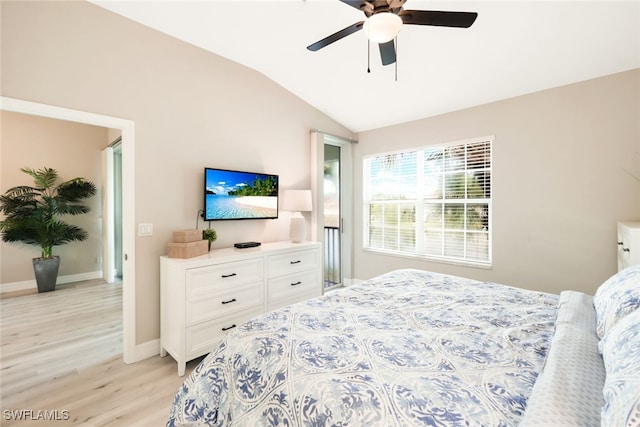 bedroom with ceiling fan, lofted ceiling, and light hardwood / wood-style flooring