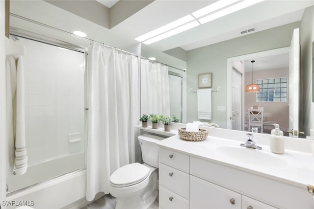 full bathroom featuring vanity, shower / bath combination with curtain, and toilet