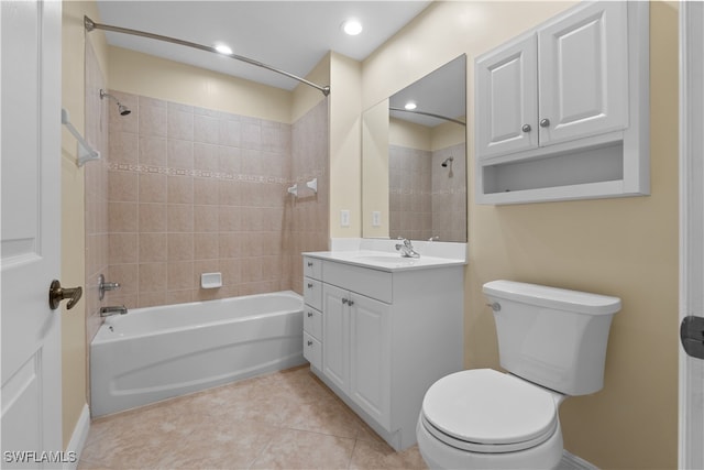 full bathroom with tile patterned flooring, vanity, toilet, and tiled shower / bath