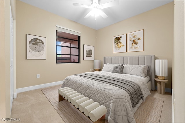 bedroom featuring ceiling fan and light colored carpet