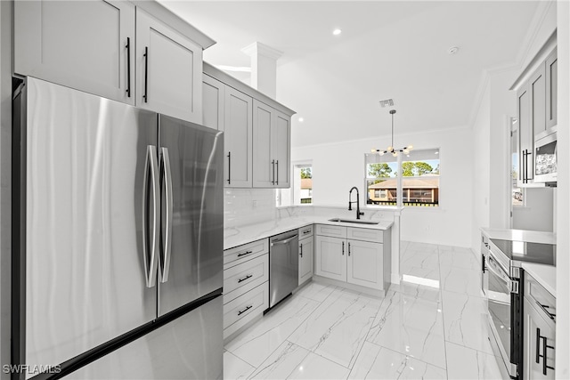 kitchen featuring sink, stainless steel appliances, decorative light fixtures, gray cabinets, and ornamental molding