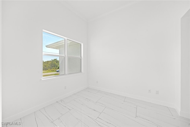 empty room featuring ornamental molding