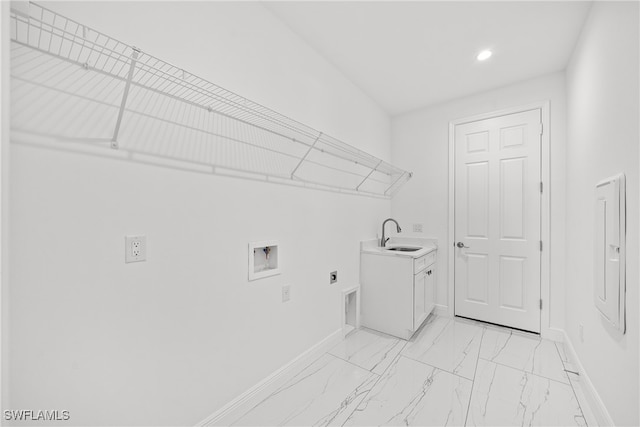 laundry room with hookup for an electric dryer, washer hookup, cabinets, and sink