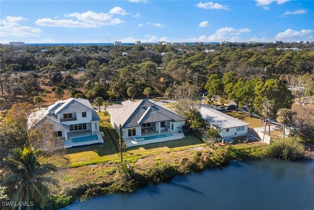 birds eye view of property with a water view