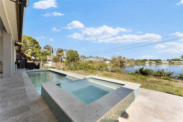 pool featuring a patio area, a water view, central AC, and an in ground hot tub