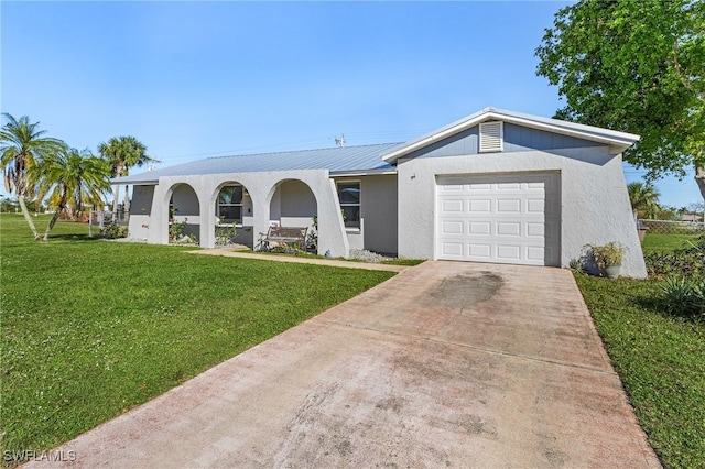 single story home featuring a garage and a front yard