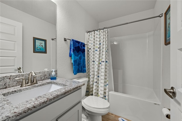 full bathroom featuring shower / bath combination with curtain, vanity, hardwood / wood-style flooring, and toilet