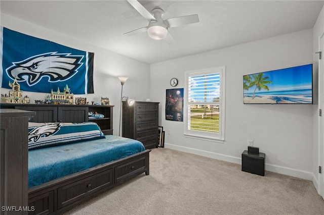 carpeted bedroom with ceiling fan