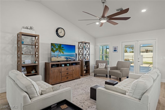 living room with high vaulted ceiling, light hardwood / wood-style flooring, and ceiling fan