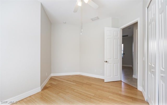 unfurnished room featuring hardwood / wood-style floors and ceiling fan