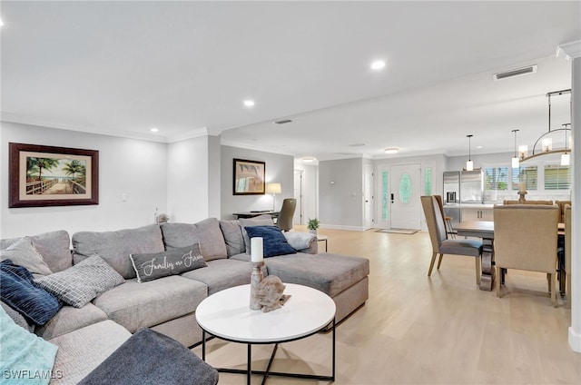 living area with light wood-style flooring, baseboards, recessed lighting, and ornamental molding