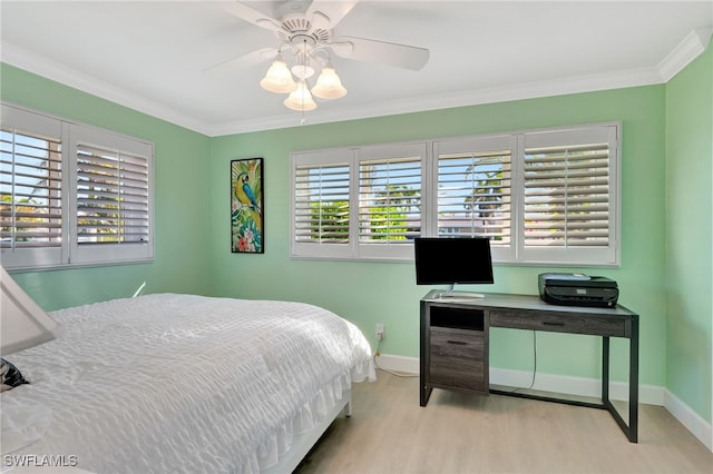 bedroom featuring ceiling fan, crown molding, and light wood-type flooring