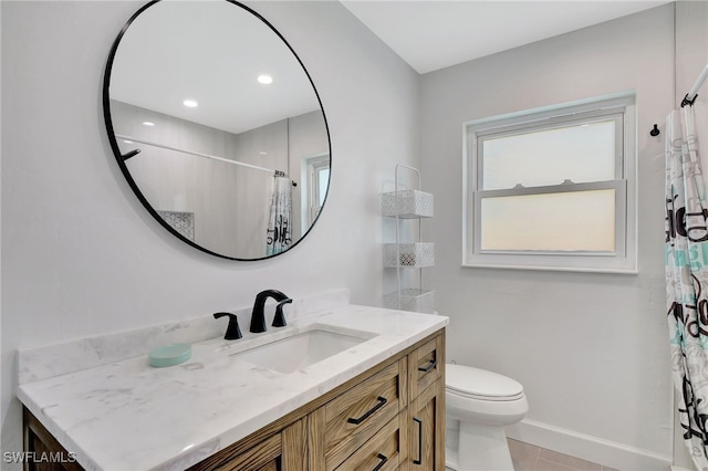 bathroom featuring toilet, vanity, tile patterned floors, and a shower with shower curtain