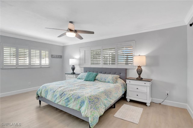 bedroom featuring wood finished floors, baseboards, ornamental molding, and a ceiling fan