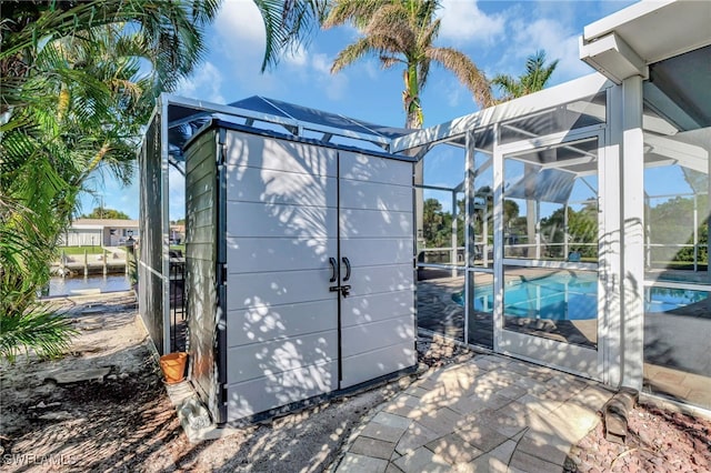 view of outbuilding with an outdoor pool