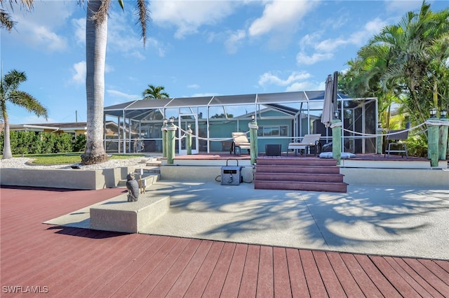 surrounding community with a patio area and a wooden deck