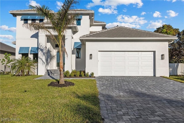 view of front facade with a garage and a front yard