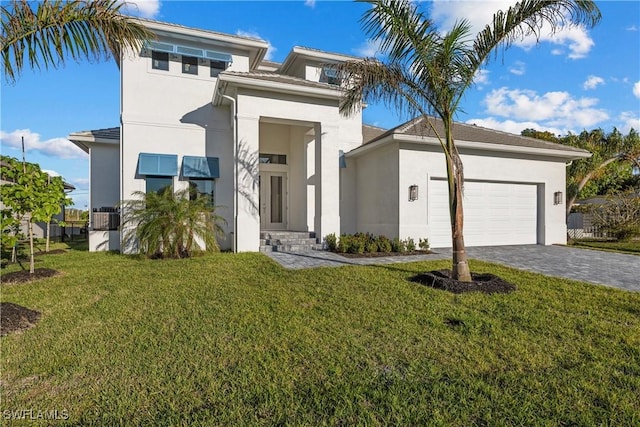 view of front facade featuring a garage and a front yard