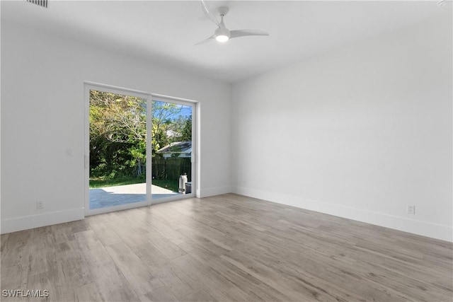 unfurnished room with ceiling fan and light hardwood / wood-style flooring