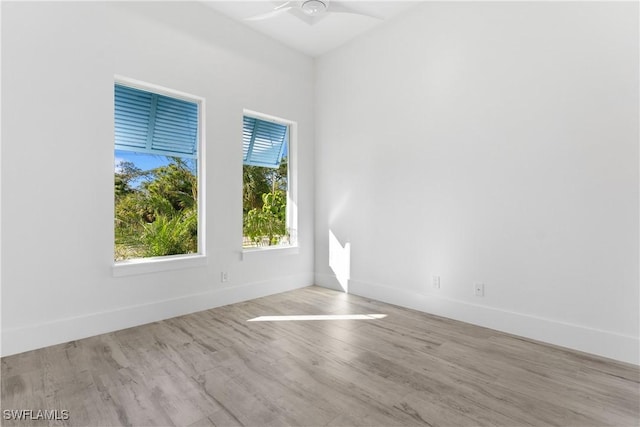 unfurnished room with light hardwood / wood-style flooring and ceiling fan