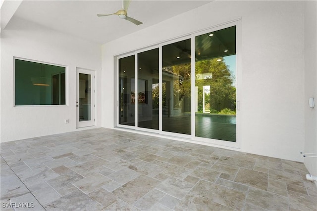 view of patio / terrace featuring ceiling fan