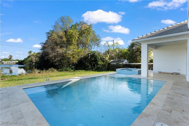 view of swimming pool with an in ground hot tub, a water view, and a patio