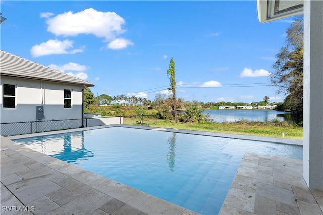 view of swimming pool featuring a water view