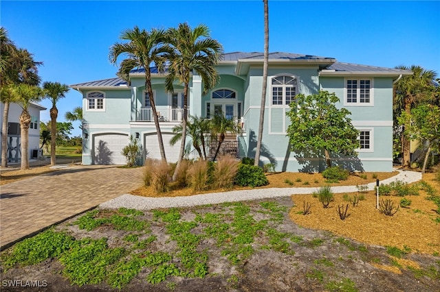 view of front of property with french doors and a garage