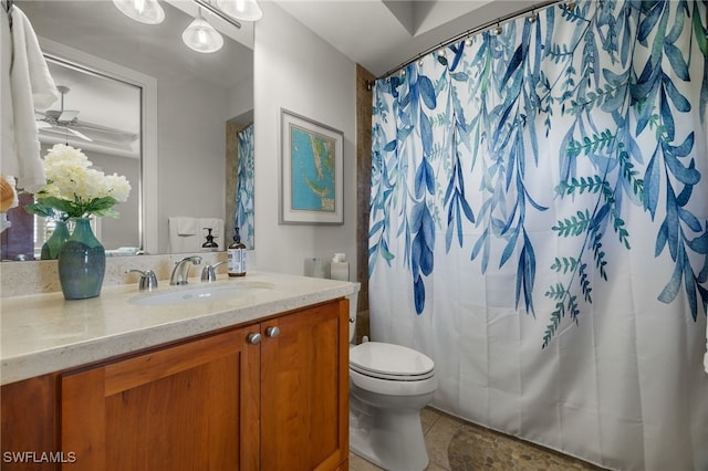 bathroom with a shower with shower curtain, vanity, toilet, and tile patterned flooring