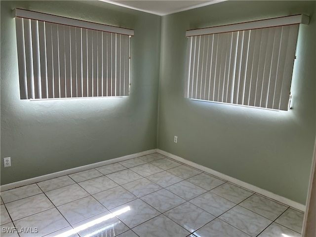 view of tiled spare room