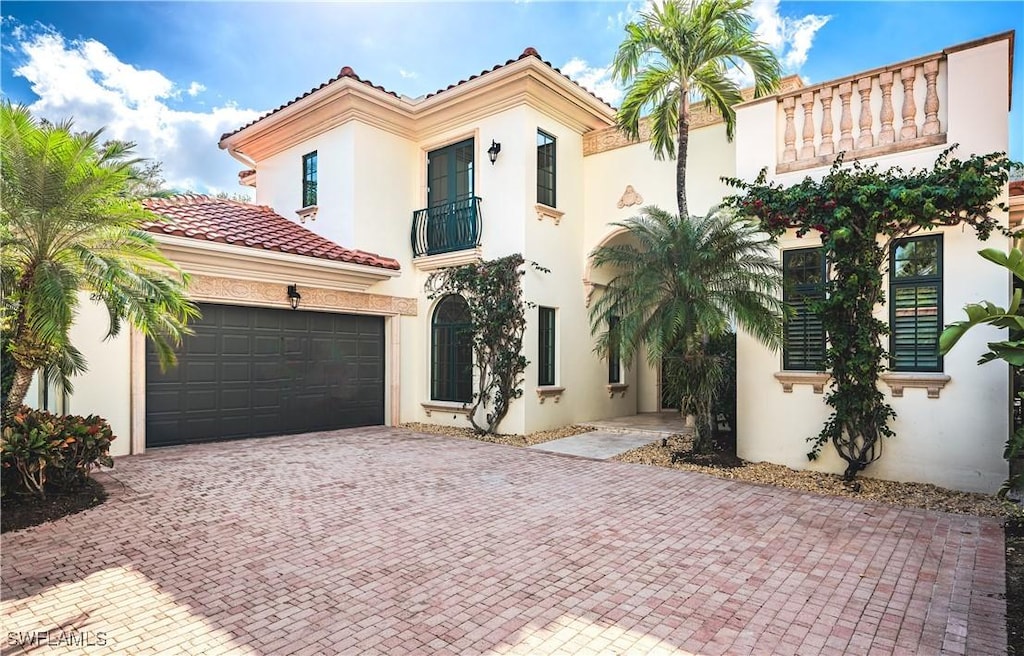 mediterranean / spanish-style home with a balcony