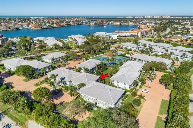 birds eye view of property with a water view