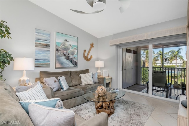 tiled living room with ceiling fan and lofted ceiling