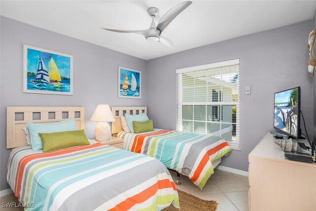 bedroom featuring ceiling fan and light tile patterned floors