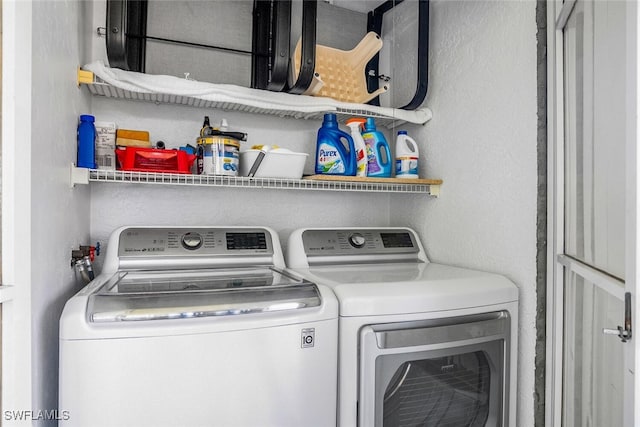 laundry room with separate washer and dryer