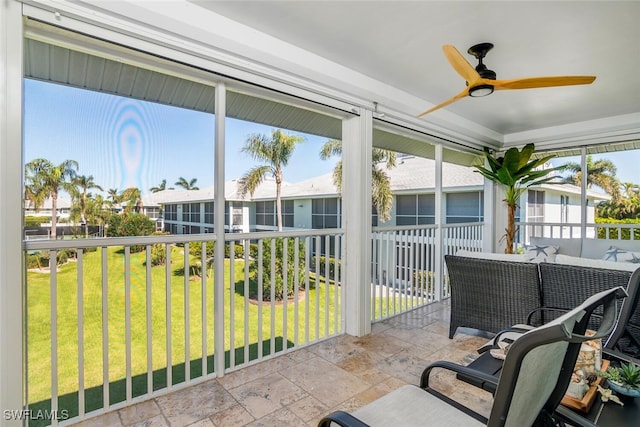 sunroom / solarium with ceiling fan