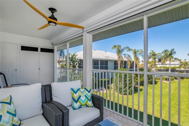 sunroom featuring ceiling fan