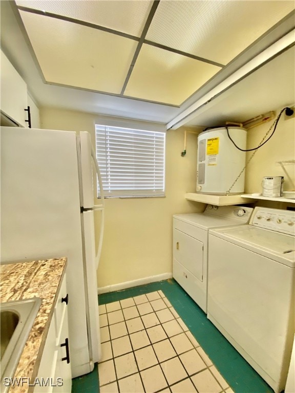 washroom featuring electric water heater and sink