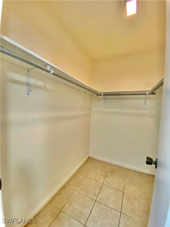 spacious closet with tile patterned flooring