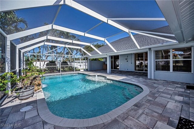 view of pool with a lanai and a patio area