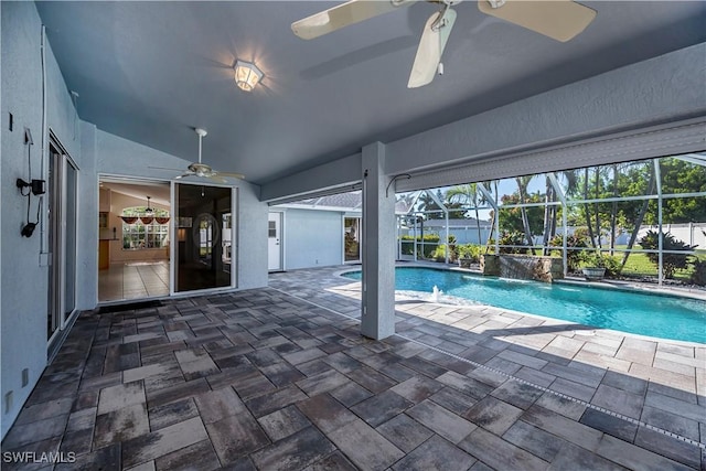 view of swimming pool with pool water feature and ceiling fan