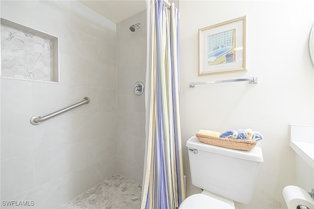 bathroom with toilet and curtained shower