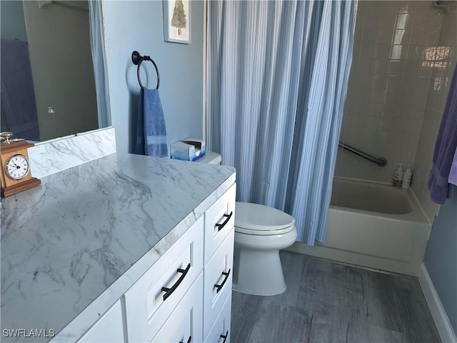 full bathroom featuring toilet, shower / bath combo, hardwood / wood-style flooring, and vanity