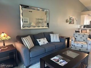 living room with lofted ceiling