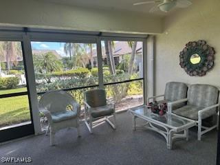 sunroom / solarium featuring ceiling fan