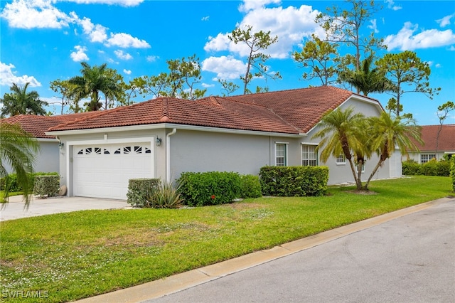 view of front of home featuring a front yard and a garage