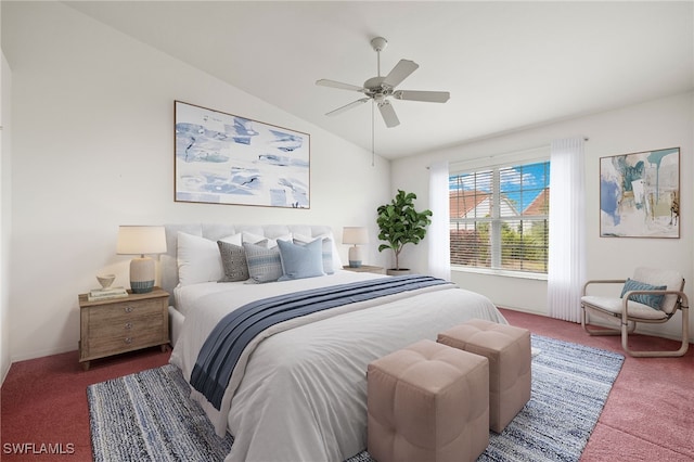 carpeted bedroom with ceiling fan and vaulted ceiling