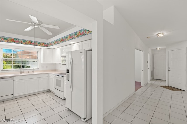 kitchen with white cabinets, white appliances, ceiling fan, and sink